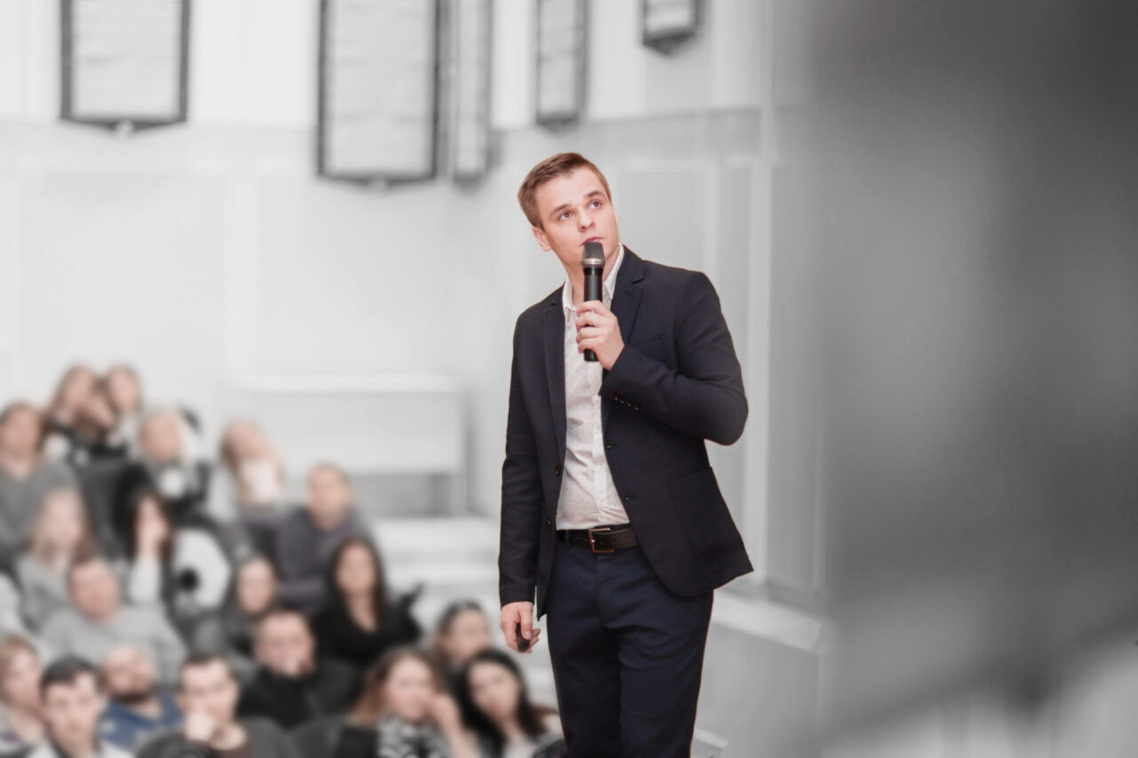 speaker conducts the business conference for journalists and aspiring entrepreneurs